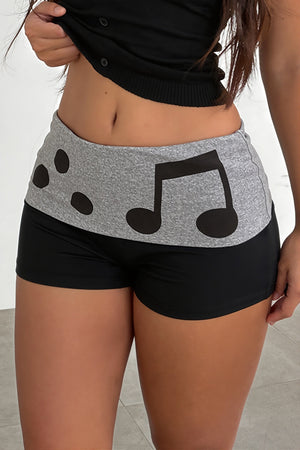BELLAGIO - Shorts neri con stampa musicale