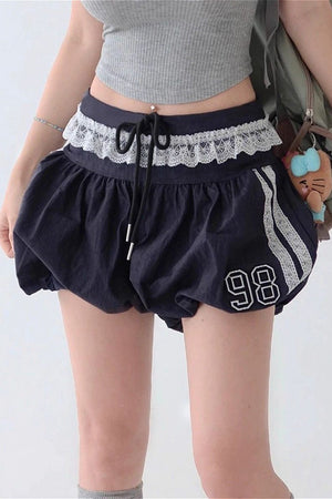 ROSA - Shorts blu a vita alta con pizzo e coulisse