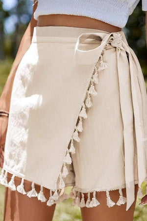 SIGRID - Minigonna beige svasata con frange