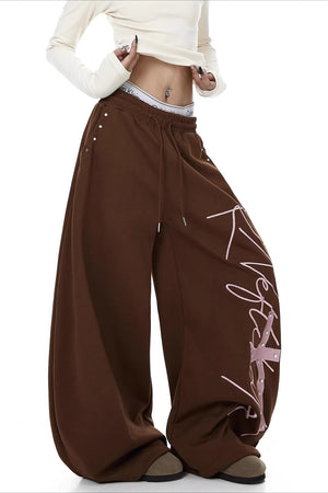 GIAGLIONE - Pantaloni wide leg curvi con stampa a contrasto